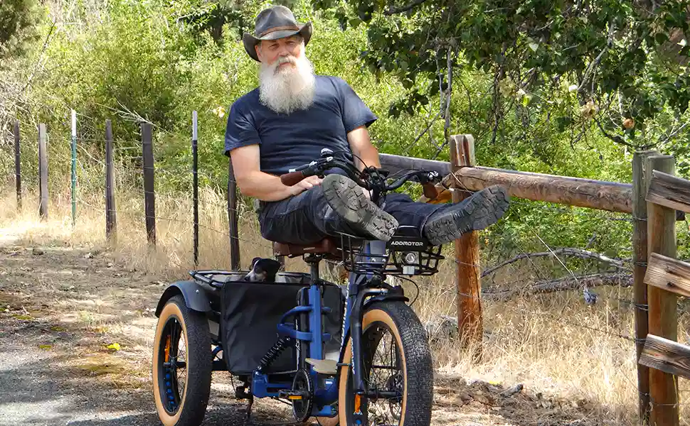 An elderly man sat stably on Grandtan X three-wheeled motorized tricycle.